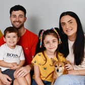 Rudi Bell, four, with dad Ross, mum Sam, sister Rosie, seven, and pet dog Luna. Pic: Michael Gillen