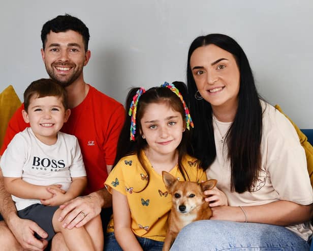 Rudi Bell, four, with dad Ross, mum Sam, sister Rosie, seven, and pet dog Luna. Pic: Michael Gillen