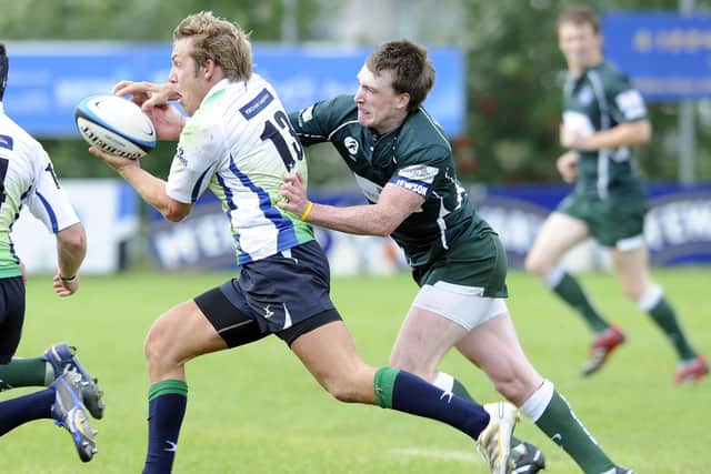Stuart Hogg, in the green of Hawick, tackles Boroughmuir's Malcolm Clapperton in August 2010.  (Picture: Ian Rutherford / The Scotsman)