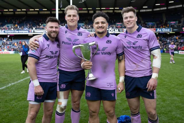 Ali Price, Duhan van der Merwe, Sione Tuipulotu and Huw Jones celebrate with the Cuttitta Cup after beating Italy. (Photo by Craig Williamson / SNS Group)