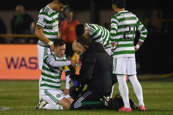 Celtic's  players show concern for Callum McGregor following the faciall injury that has raised concerns of an extended period on the sidelines for the player. (Photo by Craig Foy / SNS Group)