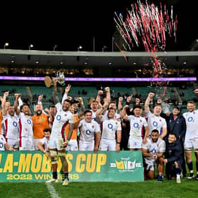 England's team celebrate their victory over Australia in Sydney.