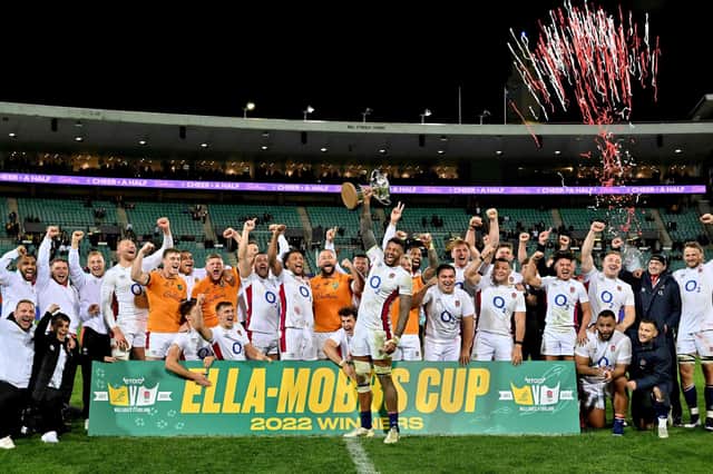 England's team celebrate their victory over Australia in Sydney.
