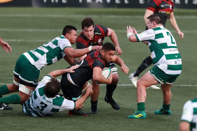 Alun Walker, right, holds up his hands as Andy Christie of Saracens is tackled during Ealing Trailfinders' cup win on Saturday. Picture: David Rogers/Getty Images