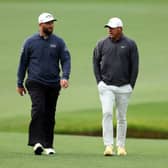 Jon Rahm and Brooks Koepka walk up the 13th fairway during the continuation of the weather-delayed third round of the 2023 Masters at Augusta National Golf Club. Picture: Andrew Redington/Getty Images.