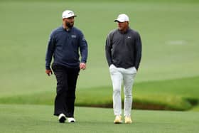 Jon Rahm and Brooks Koepka walk up the 13th fairway during the continuation of the weather-delayed third round of the 2023 Masters at Augusta National Golf Club. Picture: Andrew Redington/Getty Images.