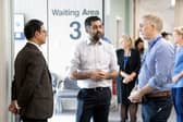 Humza Yousaf (centre) alongside Consultant Orthopedic Surgeon Andy Ballantyne (right) as they speak to a member of staff during a visit to visit the National Treatment Centre at Victoria Hospital in Kirkcaldy, Fife. Photo: Lesley Martin /PA Wire