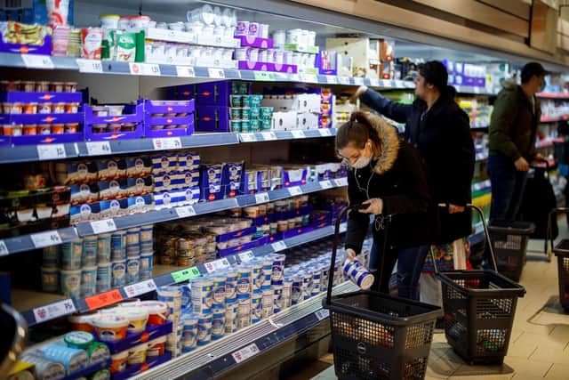 Shoppers in a supermarket before the 2m distancing rule was introduced. Picture: Tolga Akmen.