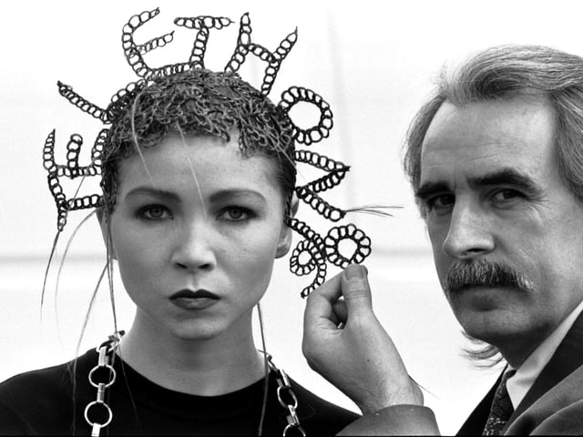 Edinburgh hairdresser Charlie Miller joined 3000 hairdressers nationwide to raise cash for charity - Mr Miller with one of the models whose hair reads out Telethon 1990.