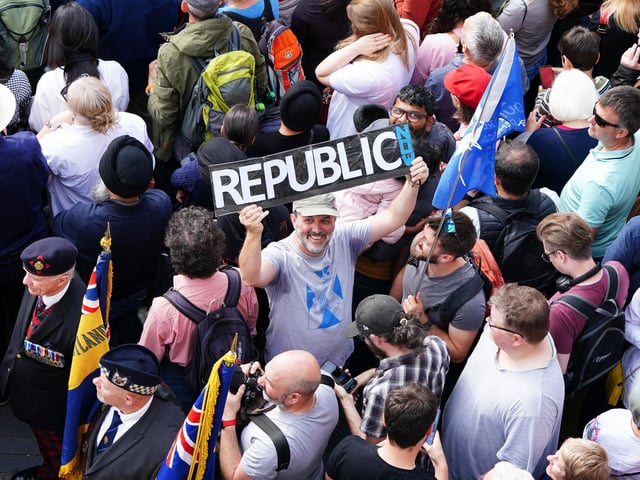 A member of the public protesting the Proclamation of Charles III.