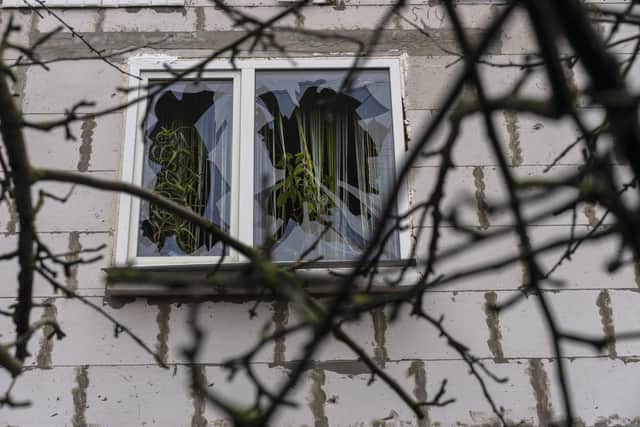 A destroyed window of a house is seen during a military sweep to search for possible remnants of Russian troops after their withdrawal from villages in the outskirts of Kyiv. Picture: AP Photo/Rodrigo Abd