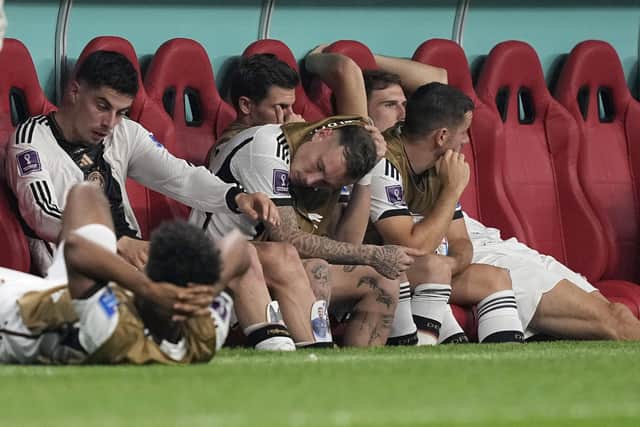 German subs on the bench react as they crash out of the World Cup.