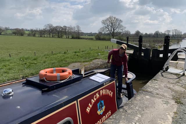 Ben Mitchell passing through one of two locks on his canal journey.