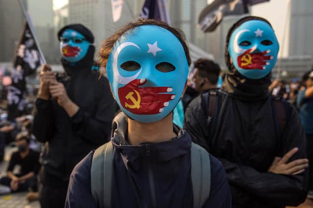 Protesters show support for the Uyghur minority in China at a 2019 rally in Hong Kong (Picture: Dale de la Rey/AFP via Getty Images)