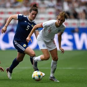 Jen Beattie and close friend Jill Scott clash in Scotland's game with England at the 2019 World Cup (Photo by CHRISTOPHE SIMON / AFP)        (Photo credit should read CHRISTOPHE SIMON/AFP via Getty Images)