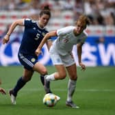 Jen Beattie and close friend Jill Scott clash in Scotland's game with England at the 2019 World Cup (Photo by CHRISTOPHE SIMON / AFP)        (Photo credit should read CHRISTOPHE SIMON/AFP via Getty Images)