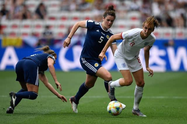 Jen Beattie and close friend Jill Scott clash in Scotland's game with England at the 2019 World Cup (Photo by CHRISTOPHE SIMON / AFP)        (Photo credit should read CHRISTOPHE SIMON/AFP via Getty Images)