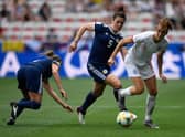 Jen Beattie and close friend Jill Scott clash in Scotland's game with England at the 2019 World Cup (Photo by CHRISTOPHE SIMON / AFP)        (Photo credit should read CHRISTOPHE SIMON/AFP via Getty Images)