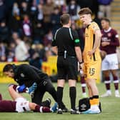 Hearts midfielder Cammy Devlin receives treatment during the 0-0 draw with Livingston.
