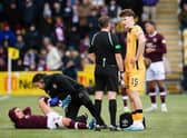 Hearts midfielder Cammy Devlin receives treatment during the 0-0 draw with Livingston.
