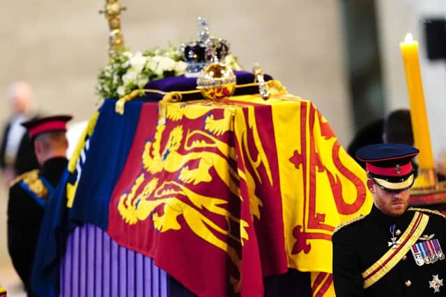 Queen Elizabeth II 's grandchildren Britain's Prince William, Prince of Wales (left) and Britain's Prince Harry, Duke of Sussex (right) hold a vigil at the coffin of their 'grannie'. Picture: Aaron Chown/AFP via Getty Images