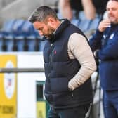 Lee Johnson looks crestfallen during Hibs' 1-0 defeat by Falkirk in the Premier Sports Cup.