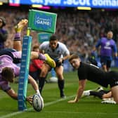 An airborne Darcy Graham scores what looks like a spectacular try against New Zealand only for it to be overturned for a foot in touch. (Photo by Ross MacDonald / SNS Group)