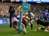 An airborne Darcy Graham scores what looks like a spectacular try against New Zealand only for it to be overturned for a foot in touch. (Photo by Ross MacDonald / SNS Group)
