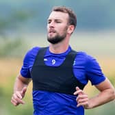 Hibs striker Christian Doidge is back working hard in training to make up lost ground on his team-mates in the battle for full fitness. Photo by Mark Scates / SNS Group