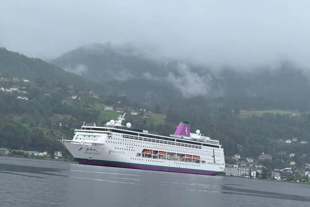 Classy cruise ship the Ambassador Ambition ported in picturesque Ulvik