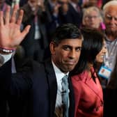Prime Minister Rishi Sunak waves as he and his wife Akshata Murty leave following his speech during the final day of the Conservative Party Conference. Photo: Getty