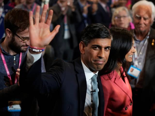 Prime Minister Rishi Sunak waves as he and his wife Akshata Murty leave following his speech during the final day of the Conservative Party Conference. Photo: Getty