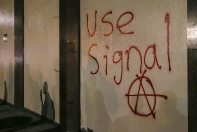 Graffiti urging people to use Signal spray-painted on a wall during a protest at the University of California, Berkeley in 2017, in response to a scheduled speech by controversial Breitbart writer Milo Yiannopoulos (Photo: Elijah Nouvelage/Getty Images)