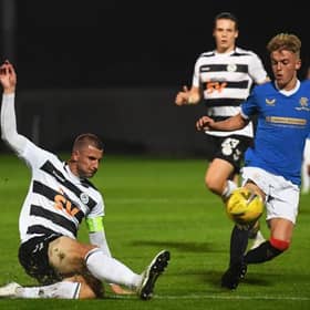 Rangers' Ross McCausland (right) competes with Sean McGinty during the SPFL Trust Trophy match between Rangers B and Ayr United at the C&G Systems Stadium on September 14, 2021, in Dumbarton, Scotland.  (Photo by Craig Foy / SNS Group)