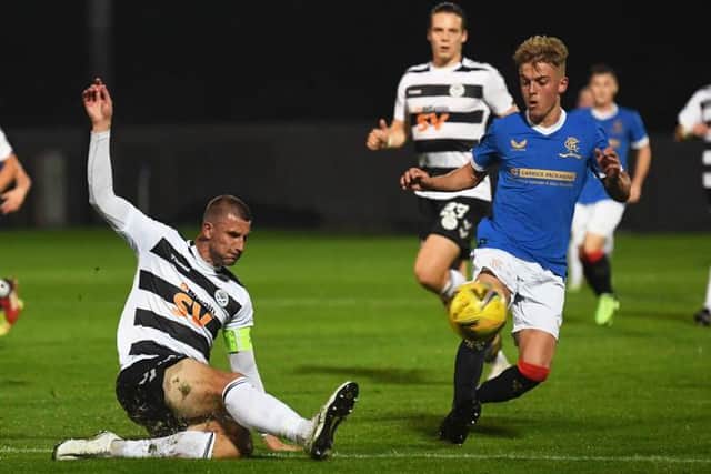 Rangers' Ross McCausland (right) competes with Sean McGinty during the SPFL Trust Trophy match between Rangers B and Ayr United at the C&G Systems Stadium on September 14, 2021, in Dumbarton, Scotland.  (Photo by Craig Foy / SNS Group)