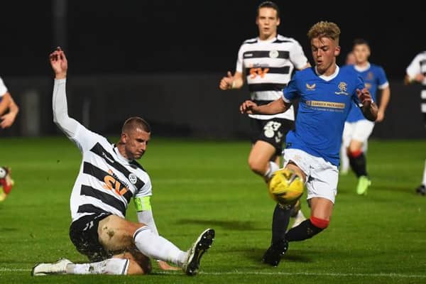 Rangers' Ross McCausland (right) competes with Sean McGinty during the SPFL Trust Trophy match between Rangers B and Ayr United at the C&G Systems Stadium on September 14, 2021, in Dumbarton, Scotland.  (Photo by Craig Foy / SNS Group)