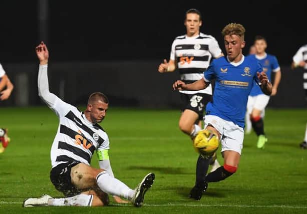 Rangers' Ross McCausland (right) competes with Sean McGinty during the SPFL Trust Trophy match between Rangers B and Ayr United at the C&G Systems Stadium on September 14, 2021, in Dumbarton, Scotland.  (Photo by Craig Foy / SNS Group)