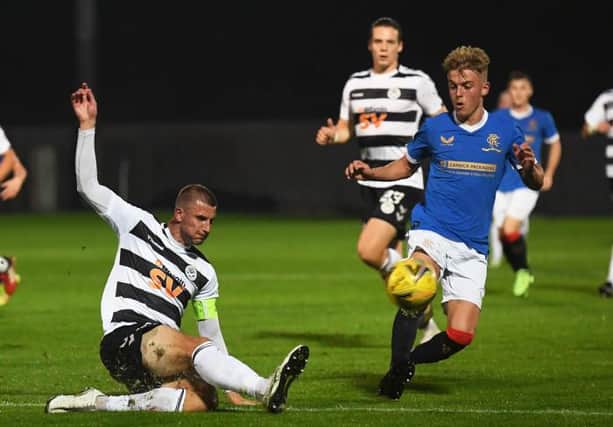 Rangers' Ross McCausland (right) competes with Sean McGinty during the SPFL Trust Trophy match between Rangers B and Ayr United at the C&G Systems Stadium on September 14, 2021, in Dumbarton, Scotland. (Photo by Craig Foy / SNS Group)