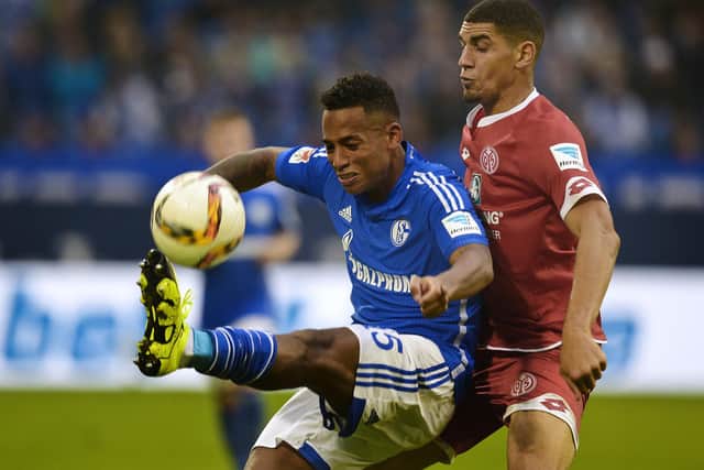 Leon Balogun, pictured (right) in action for Mainz against Schalke in 2015, played at right-back for much of his time in German football. (Photo by Sascha Schuermann/AFP via Getty Images).