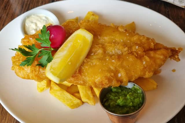 East Coast's fish supper with a pink pickled onion on top