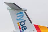 A Flybe craftcrshed after having the wheel wedges removed.