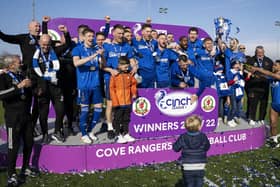 The Cove Rangers squad celebrate winning the league title.