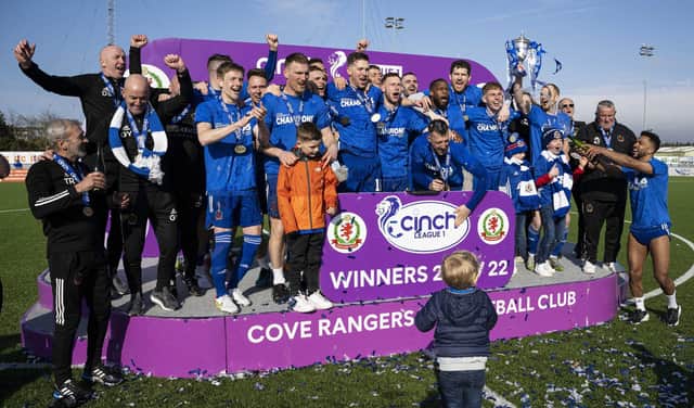 The Cove Rangers squad celebrate winning the league title.