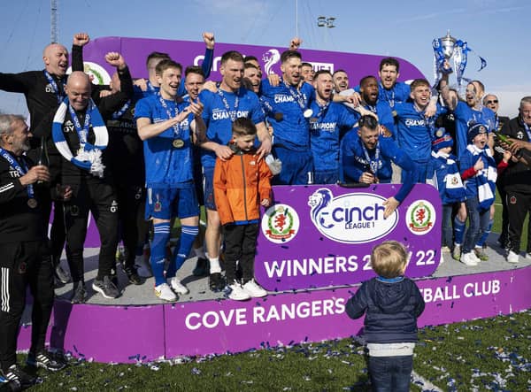 The Cove Rangers squad celebrate winning the league title.
