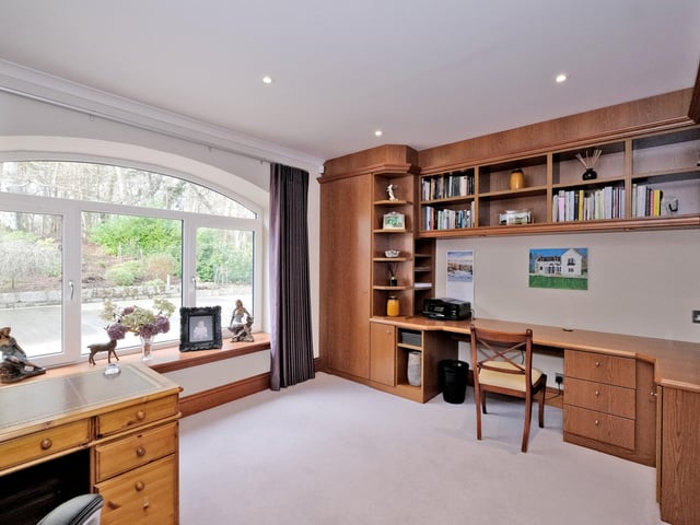 The study is the ideal place to work from with views overlooking the landscaped and thriving garden
