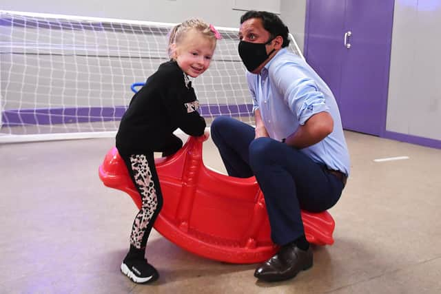 Anas Sarwar spends some time with Ariah Gilliland, 4 from Maryhill, during a visit to a mother and toddler group.