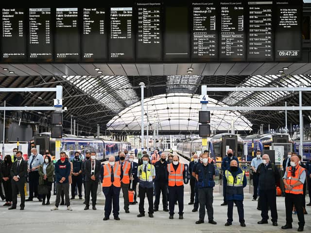 Railway staff and members of the public observe a minute’s silence at Glasgow's Queen Street Station a week after three people were killed when an Aberdeen to Glasgow train derailed on 12 August 2020, near Carmont, west of Stonehaven (Picture: Jeff J Mitchell/Getty Images)