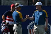 Bob MacIntyre is greeted by Europe's captain Luke Donald on the first tee ahead of his singles win over US Open champion Wyndham Clark. Picture: Andreas Solaro/AFP via Getty Images.