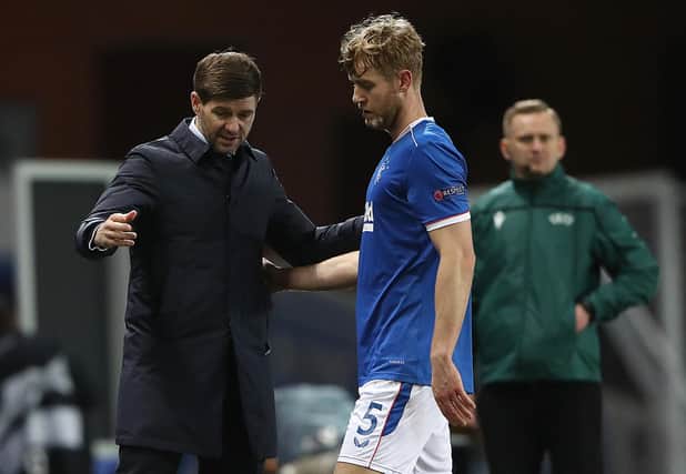 Rangers manager Steven Gerrard talks with Filip Helander during the UEFA Europa League Round of 32 match between Rangers FC and Royal Antwerp FC at  on February 25, 2021 in Glasgow, Scotland.  (Photo by Ian MacNicol/Getty Images)
