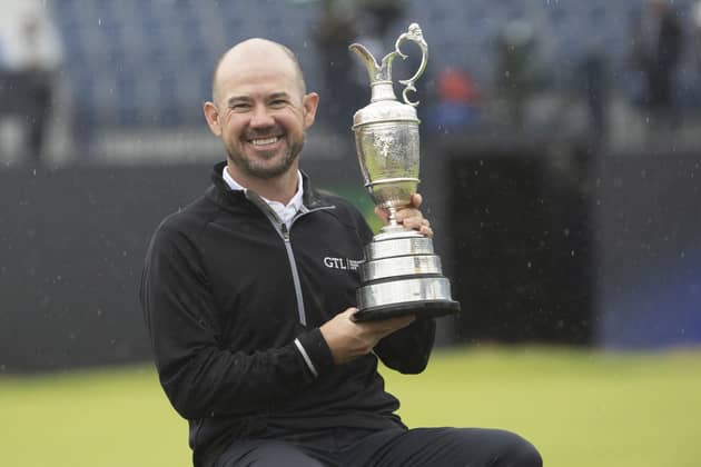 Brian Harman shows off the Claret Jug after his six-shot success in the 151st Open at Royal Liverpool. Picture: Tom Russo | The Scotsman.